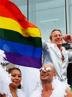 Delegats with the rainbow flag